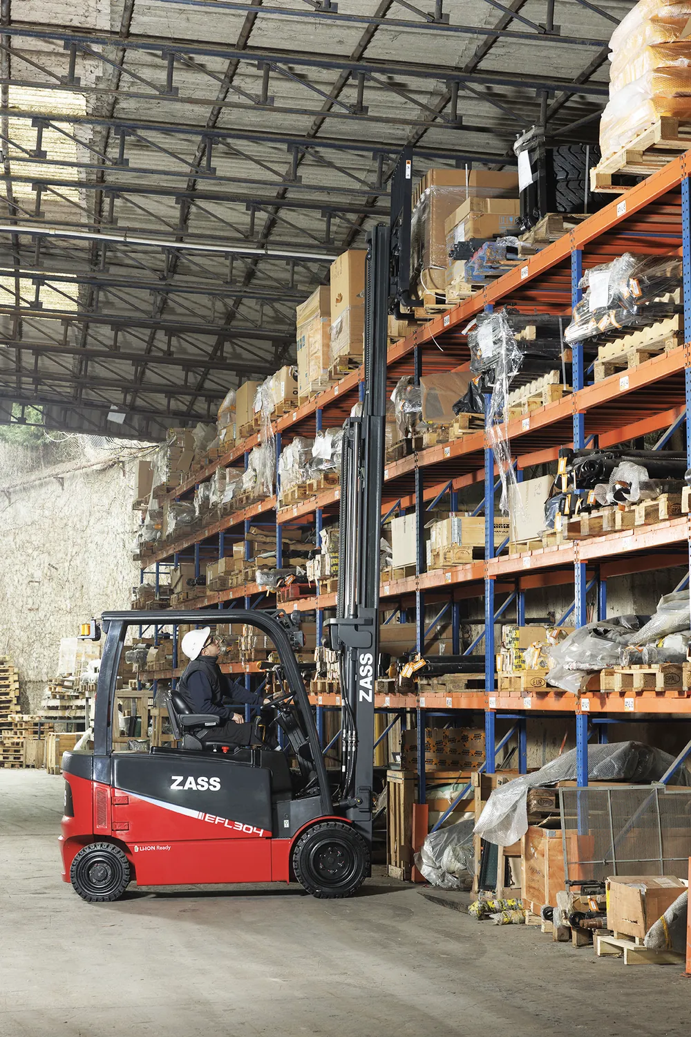 ZASS forklift lifting a load high on warehouse racking