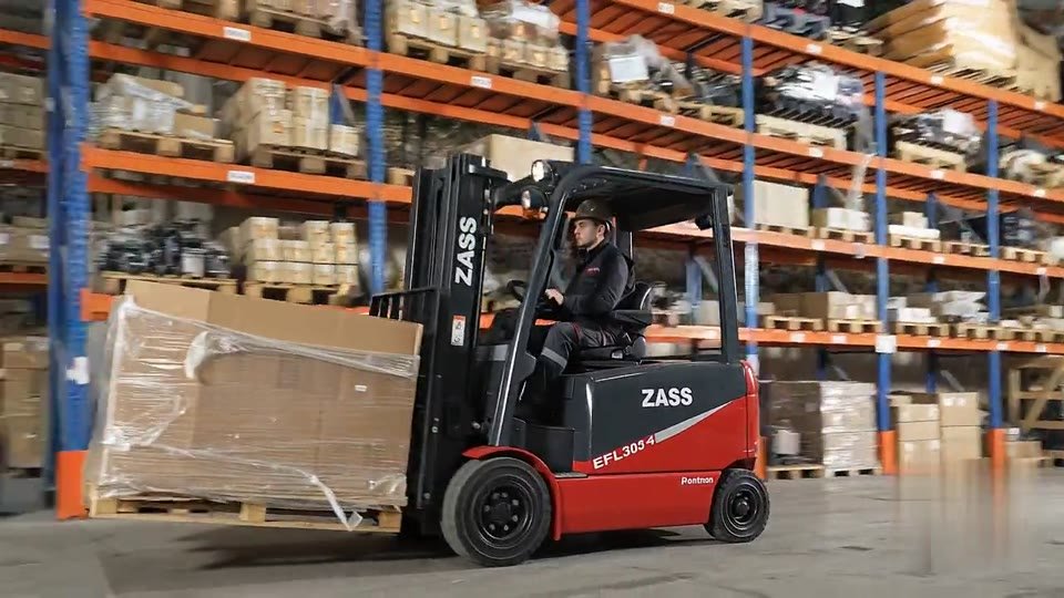 ZASS forklift moving through warehouse aisles